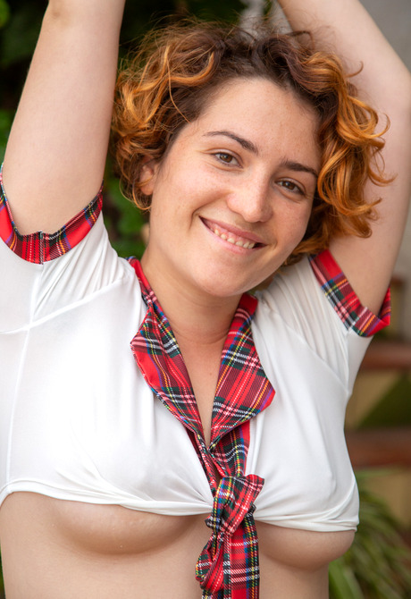 Chubby redhead Catalina A strips off jean shorts to expose hairy pussy - 6 of 16