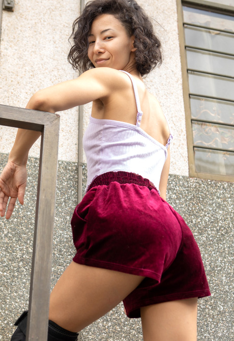Skinny athletic asian Kira R roller skating and spreading hairy pussy