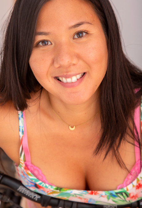 Asian amateur cutie Alaina teasing on bicycle in her jean shorts - 5 of 12