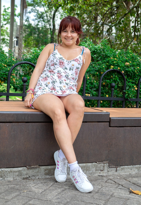 Cute redhead amateur teasing in sexy upskirts outdoors - 2 of 12