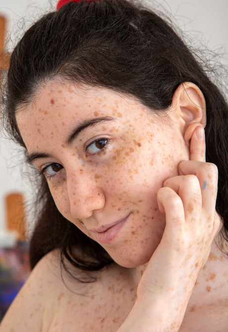 Freckled pale skin teen Elysa showing perky tits naked in studio - 13 of 16