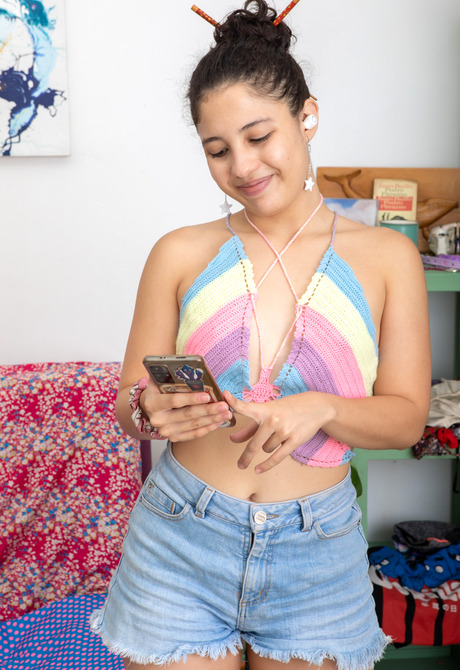 Playful teen Amalia P sharing small tits and teasing with vibrator